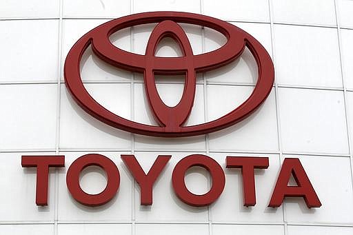In this March 30, 2011 file photo, the Toyota logo is shown at Wilsonville Toyota, in Wilsonville, Ore. 