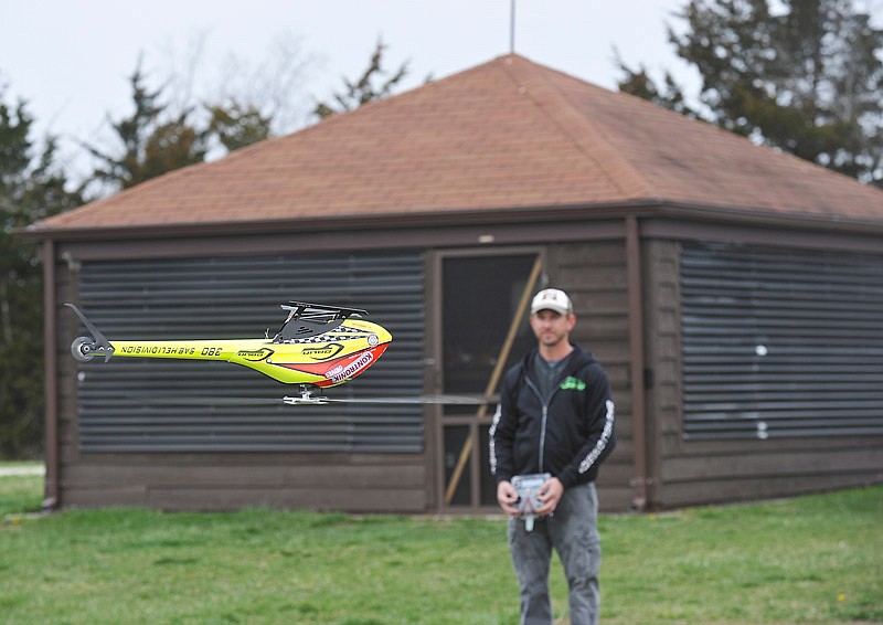 Jason Schroeder spends part of a day off work in March operating his radio-controlled helicopters. Some area residents have become unhappy with the noise of the planes at Joseph Miller RC Park on Rainbow Drive and have hired an attorney to prohibit flying at the city park located near Binder Lake.