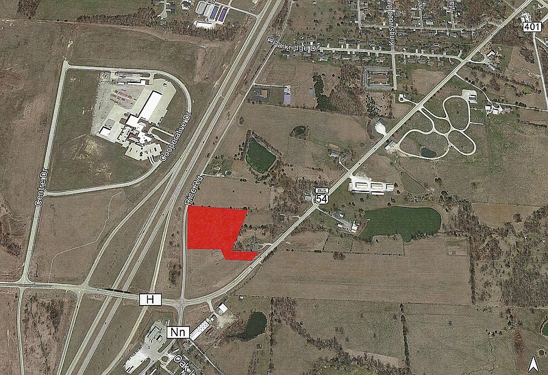 The area shaded in red is the proposed site of the new Maple Pointe Apartments.