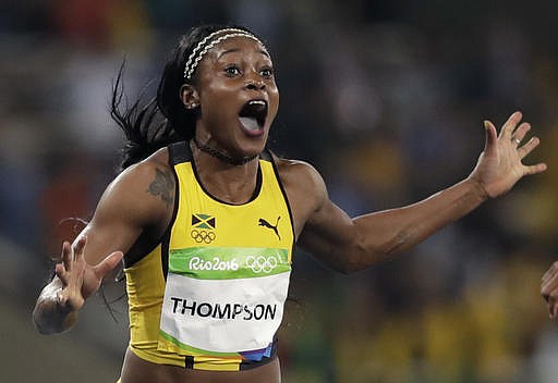 Jamaica's Elaine Thompson wins the gold medal in the women's 100-meter final during the athletics competitions of the 2016 Summer Olympics at the Olympic stadium in Rio de Janeiro, Brazil, Saturday, Aug. 13, 2016.