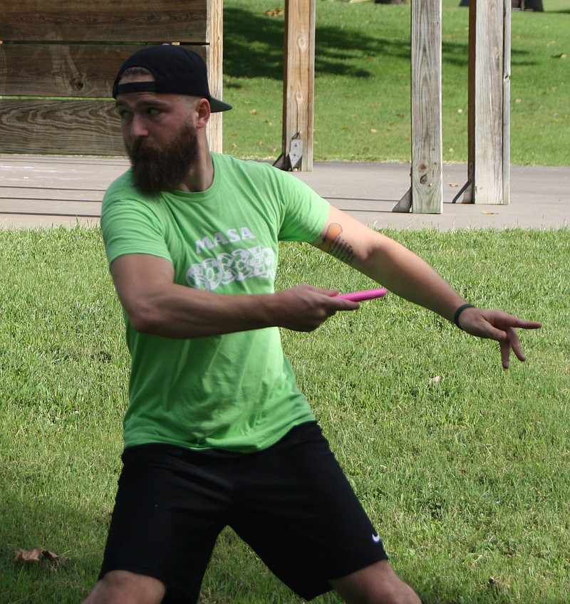 George Shellady tosses a disc Saturday, Aug. 13, 2016, at the Fulton Disc Golf Club Trilogy Challenge at Veterans Park in Fulton.