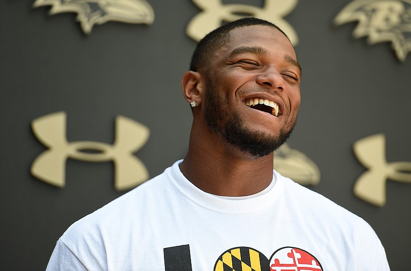 Baltimore Ravens cornerback Jimmy Smith laughs as he answers questions from reporters after NFL football training camp in Owings Mills, Md., Wednesday,  Aug. 3, 2016. 