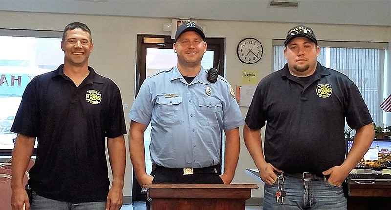 From left, Lt. Chris Hebert, Capt. Brandon Uebinger and Chief Nick Smith were sworn in at the Auxvasse Fire Department last month.