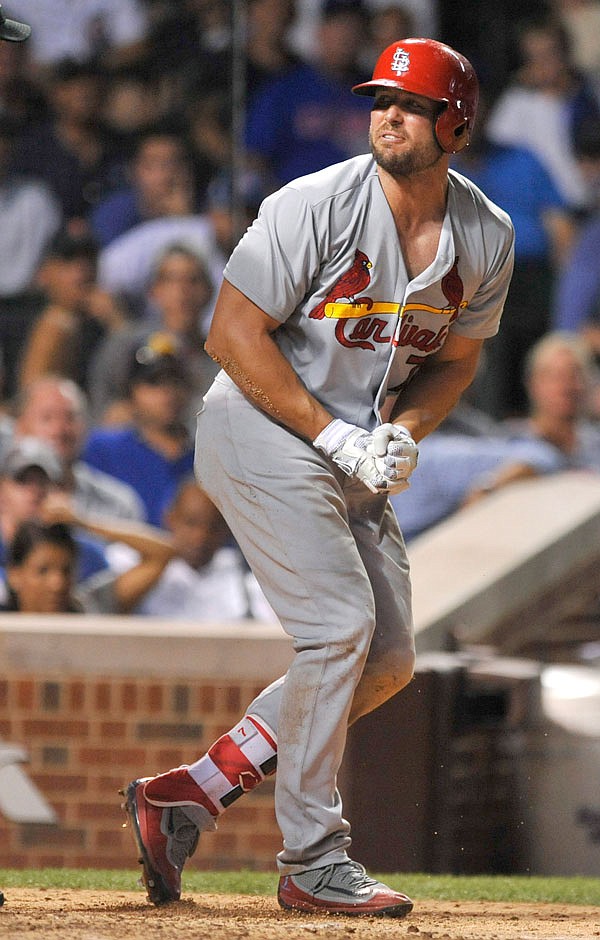 Cardinals left fielder Matt Holiday reacts after breaking his thumb on a pitch thrown by Cubs reliever Mike Montgomery during the 10th inning of last Thursday's game in Chicago. Holliday will have surgery today on his right thumb, an injury that could sideline him for the rest of the regular season.