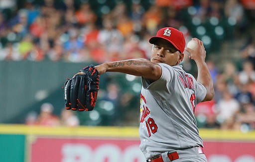 St. Louis Cardinals pitcher Carlos Martinez pitches against the Houston Astros in the first inning of a baseball game Wednesday, Aug. 17, 2016 in Houston.