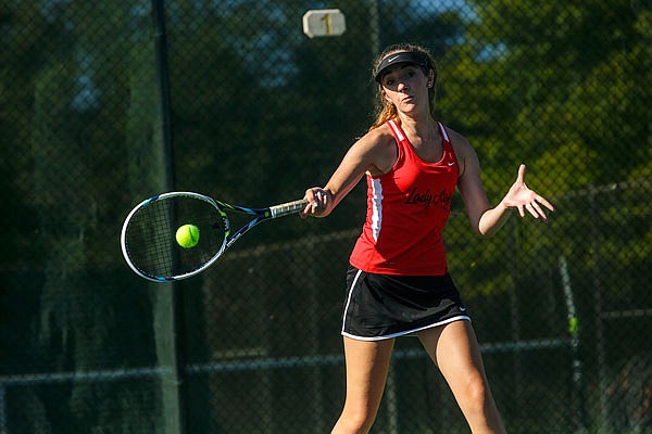 Jefferson City's Susan Meyer swings through a forehand from the baseline Tuesday afternoon during the number one doubles match against Rolla at Washington Park. 