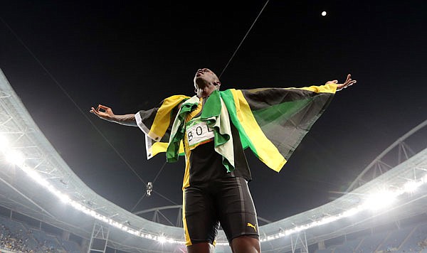Jamaica sprinter Usain Bolt celebrates winning the gold medal in the men's 4x100-meter relay final during Friday night's track and field competition of the Summer Olympics at the Olympic Stadium in Rio de Janeiro.