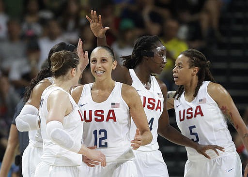 United States' Diana Taurasi (12) celebrates with teammates during a women's gold medal basketball game against Spain at the 2016 Summer Olympics in Rio de Janeiro, Brazil, Saturday, Aug. 20, 2016.