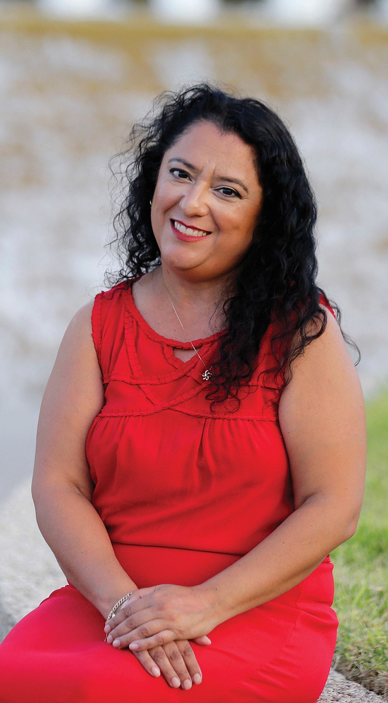 Rebecca Esparza, a two-time cancer survivor, poses for photos at the Watergardens in Corpus Christi, Texas on Thursday, July 14, 2016. She says repealing the federal Affordable Care Act, as Republicans have tried to do dozens of times in Congress, could make her uninsurable. "I realize this is something that could happen... It's a terrifying thought for me not to have any insurance at all." 