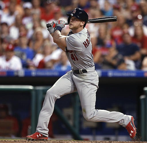 St. Louis Cardinals' Jeremy Hazelbaker follows through on a two-run home run off Philadelphia Phillies' Jeremy Hellickson during the third inning of a baseball game, Saturday, Aug. 20, 2016, in Philadelphia.