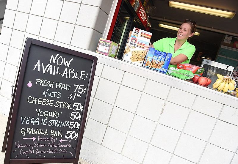 Ashley Varner with Healthy Schools, Healthy Communities has purchased a number of healthy items to provide the local football team booster clubs to sell in concession stands at Jefferson City High School and Helias.