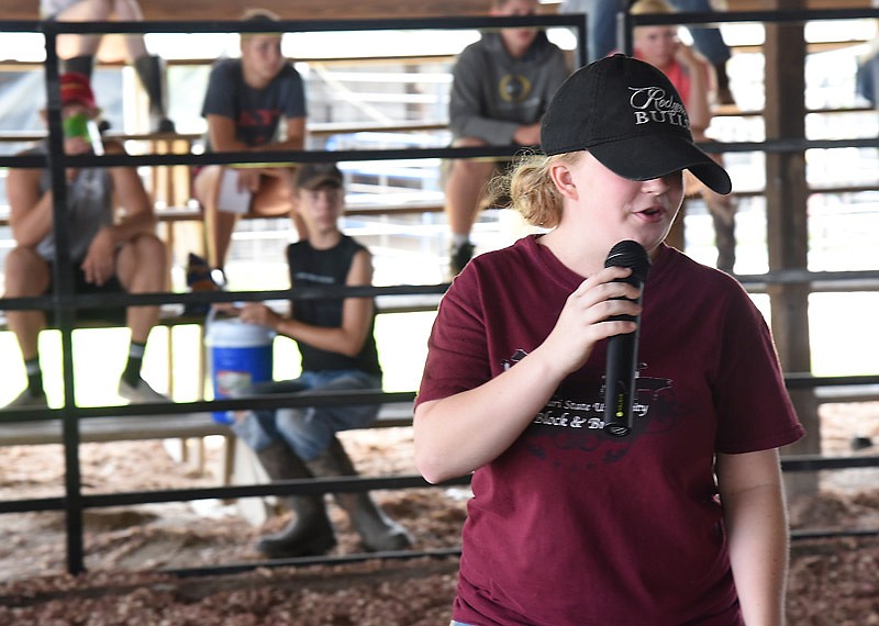 In this July 27, 2016 file photo, Bryana Binkley describes what features to look for in livestock to area FFA and 4-H students when they're in the judging ring. On Aug. 16, a steer belonging to Binkley was named 2016 grand champion market steer at the Missouri State Fair in Sedalia. She is a graduate of Calvary Lutheran High School in Jefferson City now attending Eastern Oklahoma State College,