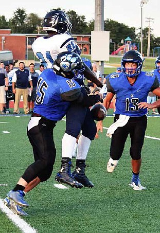 South Callaway sophomore free safety Peyton Leeper breaks up a pass intended for Tolton junior wide receiver Eyob Teklesenbet during the Bulldogs' 38-15 win over the Trailblazers in the season opener on Friday, Aug. 19, 2016 at Mokane. Leeper returned a fumble 25 yards for a touchdown early in the first quarter.