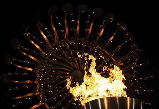 In this Saturday, Aug. 6, 2016, file photo, flames burn in the Olympic cauldron after being lit during the opening ceremony of the 2016 Summer Olympics in Rio de Janeiro, Brazil. The Rio Games officially end with a closing ceremony Sunday, Aug. 21.