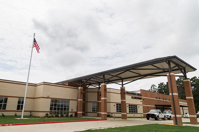 The entrance way to Waggoner Creek Elementary School offers a covered area for picking up and dropping off students. 
