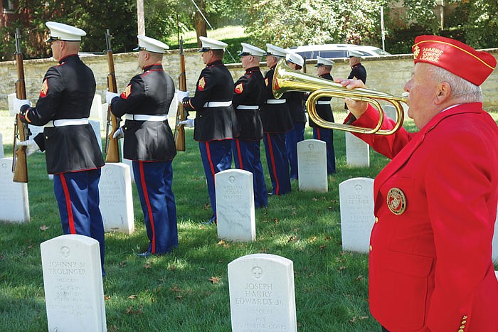 Dave Schulte plays "Taps" with the other members of the Color Guard for the Samuel F. Gearhart Detachment of the Marine Corps League at the end of a Sunday ceremony. It commemmorated the 50th anniversary of the death of Lance Cpl. Dale Clark, the first Cole County resident to die in the Vietnam War.