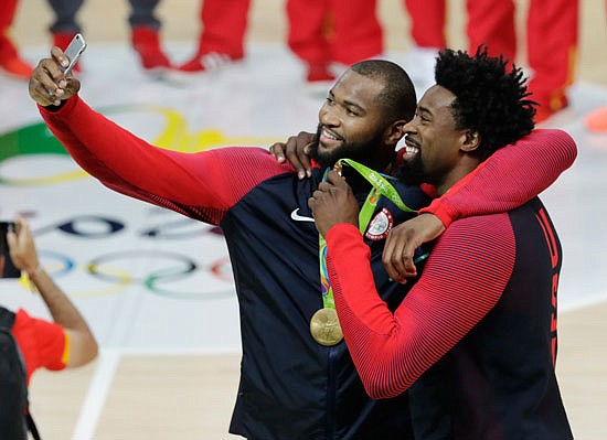 United States teammates DeMarcus Cousins and DeAndre Jordan take a selfie with their gold medals Sunday in Rio de Janeiro.