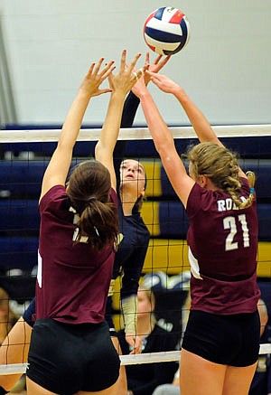 Ellie Rockers of Helias taps the ball over the net during a match last season at Rackers Fieldhouse.