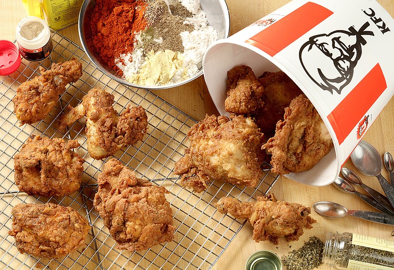 We didn't taste much of a difference between Kentucky Fried Chicken, right, and the fried chicken, left, on wire rack, we made in our test kitchen using a recipe that may - or may not - be Colonel Sanders' secret blend of 11 herbs and spices.