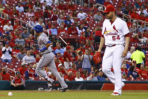 New York Mets' Wilmer Flores, left, rounds the bases after hitting a three-run home run off St. Louis Cardinals starting pitcher Jaime Garcia, right, during the first inning of a baseball game Tuesday, Aug. 23, 2016, in St. Louis.