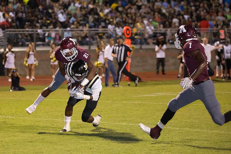 Atlanta defender Kelton Young makes a tackle against Pittsburg last year. After UIL Realignment, the Rabbs and Pirates are district foes in District 7-4A, Division II. The other teams in the district are Gilmer, Gladewater, Pleasant Grove and Spring Hill. All but one of the teams—Spring Hill—made the playoffs last season.
 