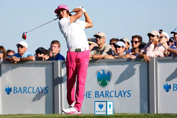 In this Aug. 23, 2013, file photo, Rickie Fowler hits a tee shot on the 17th hole during the third round of The Barclays in Jersey City, N.J.