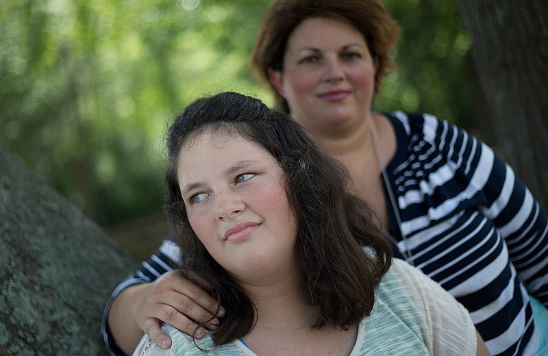 In this July 22, 2016 photo, Kaley Zacher poses for a portrait with her mother Kimberly, in Dublin, Ga. Zacher, gave permission for Kaley to be paddled twice at Southwest Laurents Elementary School, Ga. Although the use of corporal punishment in American schools has declined in recent decades, paddling is still on the books in 19 states, despite calls from the U.S. Education Department to curb punitive disciplinary measures, which has been shown to affect minority and disabled students disproportionately.