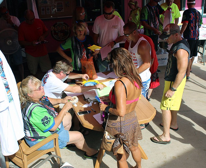 In this August 2014 file photo, Lake of the Ozarks Shootout Poker Run participants register for the event at Backwater Jack's in Osage Beach.