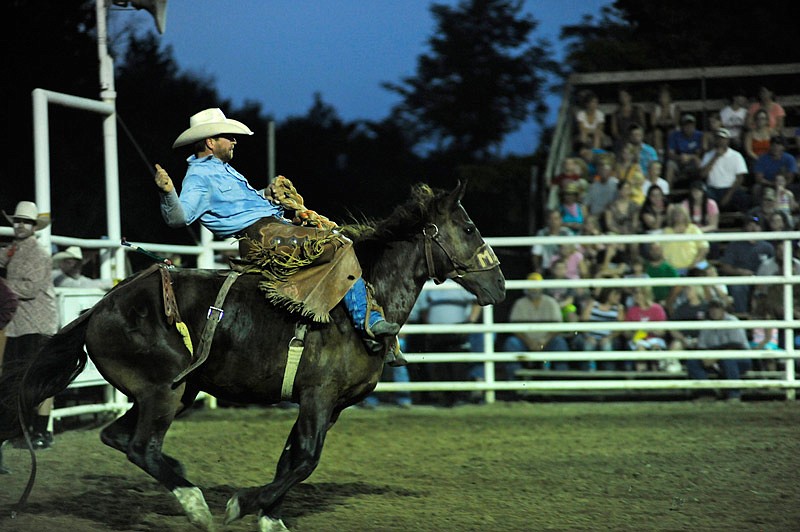 In this Aug. 23, 2014 News Tribune file photo, Keith Brauer, of Freeburg, Ill., competes in a saddle bronc riding event at Cattlemen Days Rodeo in Ashland, Mo.