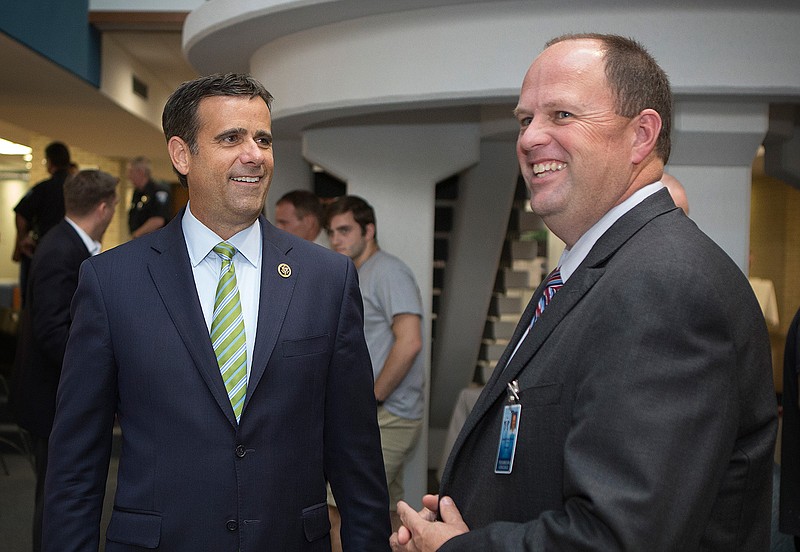 U.S. Rep. John Ratcliffe, R-Texas, and Texarkana College President James Henry Russell share a laugh Thursday, Aug. 25, 2016 during an open house organized by the congressman on the TC campus. About 50 people attended the event. Ratcliffe is holding a similar event in Paris, Texas, next week.