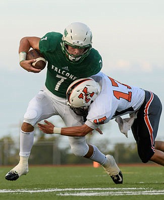 Jake Van Ronzelen of Blair Oaks tries to stay on his feet during last Friday night's season opener at the Falcon Athletic Complex in Wardsville.