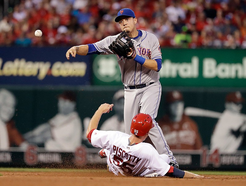 St. Louis Cardinals' Stephen Piscotty, bottom, is out at second as New York Mets second baseman Wilmer Flores turns the double play during the fourth inning of a baseball game Thursday, Aug. 25, 2016, in St. Louis. Yadier Molina was out at first.
