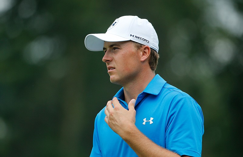 In this July 29, 2016, file photo, Jordan Spieth watches his approach shot on the fifth hole during the second round of the PGA Championship golf tournament at Baltusrol Golf Club in Springfield, N.J. Spieth missed being part of the Olympics even before the golf began. Rory McIlroy thought it was a big hit and was thankful to be wrong. They were among the top four who chose not to go. 