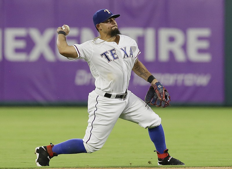 Texas Rangers second baseman Rougned Odor throws after fielding a grounder during a baseball game against the Cleveland Indians in Arlington, Texas, Thursday, Aug. 25, 2016. 