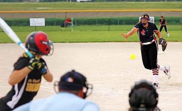 Jefferson City pitcher Megan Green delivers a pitch to Kaylie Oligschlaeger of St. Elizabeth during Thursday night's game at 63 Diamonds.