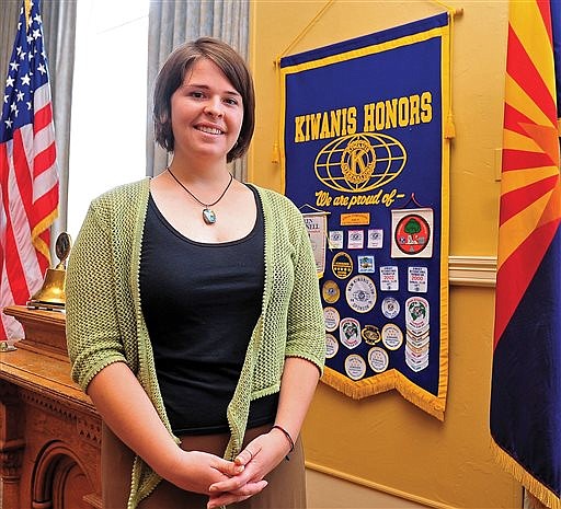 In this May 30, 2013, file photo, Kayla Mueller poses after speaking to a group in Prescott, Ariz. Mueller, a humanitarian aid worker from Prescott, was kidnapped in Syria in 2013. Her family and the Obama administration confirmed her death in February 2015. Former hostages say Mueller remained steadfast in her Christian faith and stood up to her captors despite being tortured, raped and verbally abused.The ex-hostages spoke publicly for the first time in an interview with ABC News airing Friday, Aug. 26 2016. (Matt Hinshaw/The Daily Courier via AP)