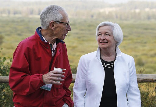 Federal Reserve Chair Janet Yellen, right, talks with Stanley Fischer, vice chairman of the Board of Governors of the Federal Reserve System, before her speech to the annual invitation-only conference of central bankers from around the world, Friday, Aug 26, 2016, at Jackson Lake Lodge in Grand Teton National Park, north of Jackson Hole, Wyo. 