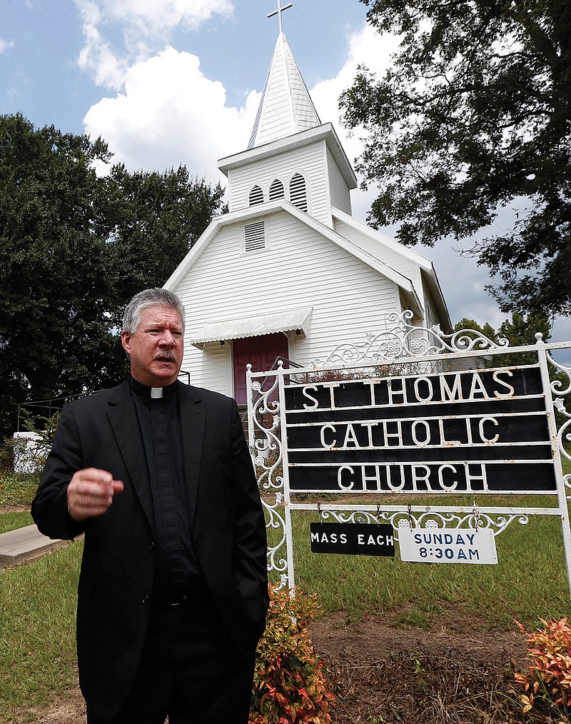 Rev. Greg Plata, speaks  outside the St. Thomas Catholic Church that he pastors Friday, Aug. 26, 2016 in Lexington, Miss.,  about the community loss with the murders of Sister Margaret Held and Sister Paula Merrill, both nurse practitioners in the town. The two women, who worked in the rural Mississippi Delta, were found slain in their home in neighboring Durant, Thursday.