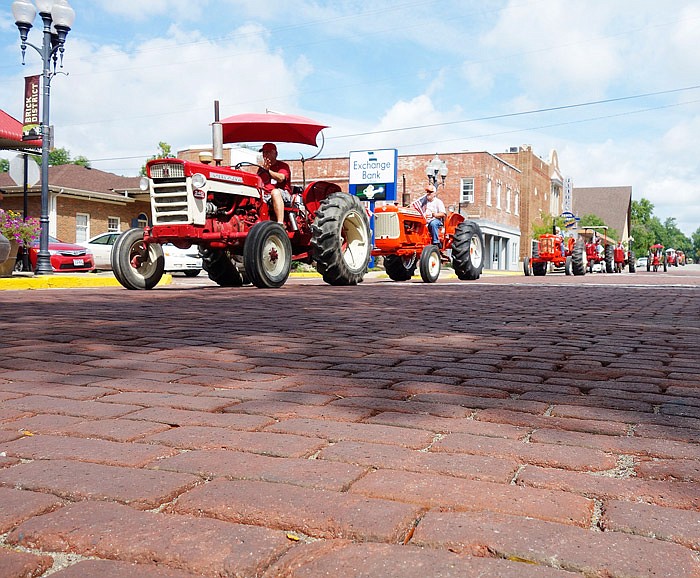 Tractors parade down Court Street on Saturday, Aug. 27, 2016 during the Kingdom of Callaway Historical Society's 11th annual vintage tractor drive.