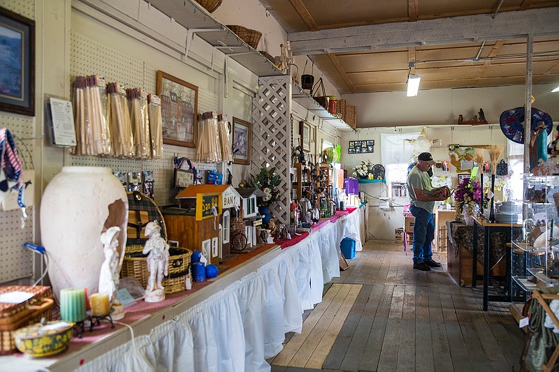 A customer looks through stacks of comics for sale at Laurie's Vintage Store on Aug. 21 at the Texarkana Country Store.