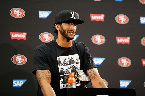 49ers quarterback Colin Kaepernick answers questions at a news conference after Friday's preseason game against the Packers in Santa Clara, Calif.