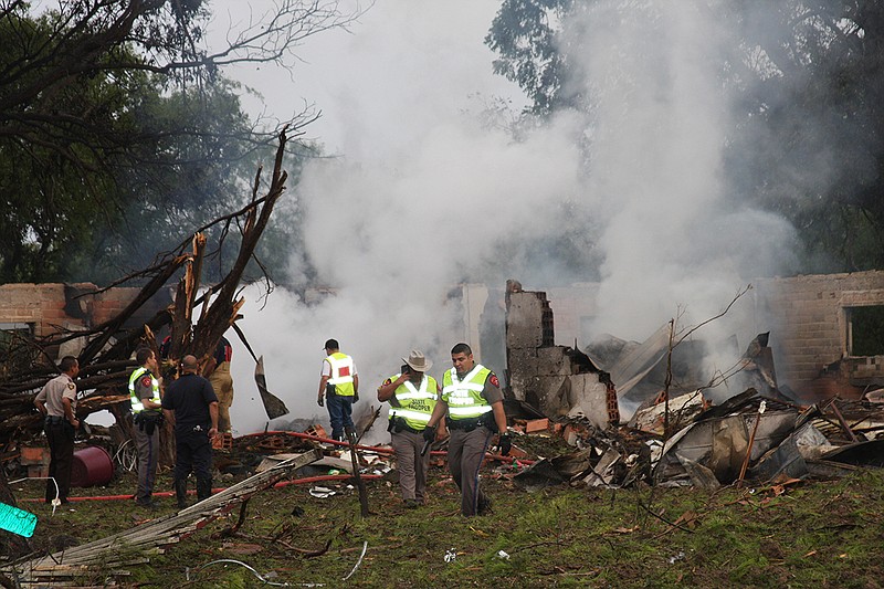 Authorities work the scene after a truck carrying Takata inflators and a volatile chemical exploded Monday in the Texas border town of Quemado, killing a woman and injuring four others. Takata Corp. said it sent people to the site and is helping authorities investigate the crash.