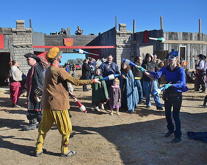 Jugglers show off their skills at last year's renaissance festival at Boster Castle in Callaway County. The castle property is owned by Adam Boster, below.