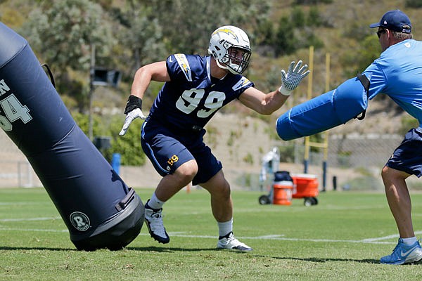 In this June 6 file photo, Chargers rookie defensive end Joey Bosa trains during practice in San Diego. The Chargers announced they've signed Bosa to a four-year contract.