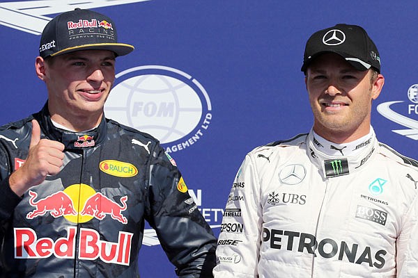 Max Verstappen gives the thumbs up as he stands next to Nico Rosberg on the podium after qualifying Saturday at the Belgian Formula One in Spa-Francorchamps, Belgium.