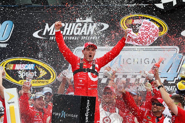 Kyle Larson celebrates Sunday after his win in the Sprint Cup Series race at Michigan International Speedway in Brooklyn, Mich.