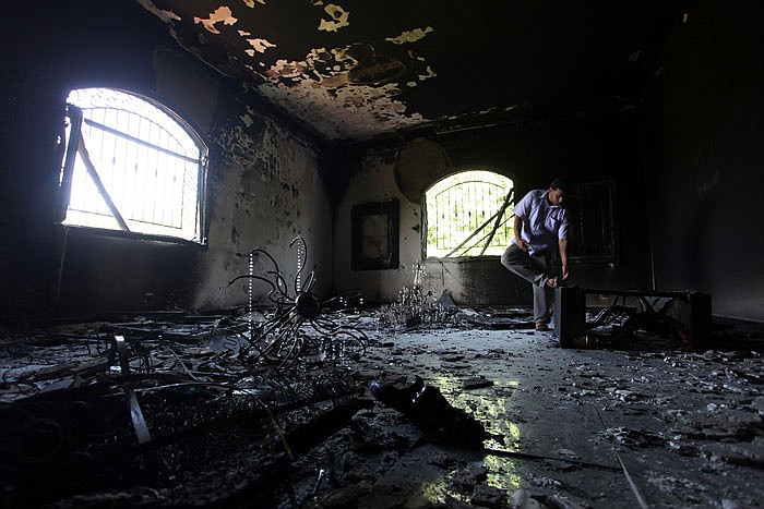 A Libyan man investigates the inside of the U.S. consulate in Benghazi, Libya, after a deadly attack two days earlier. The State Department says about 30 emails that may be related to the 2012 attack on U.S. compounds in Benghazi, are among the thousands of Hillary Clinton emails recovered by the FBI.
