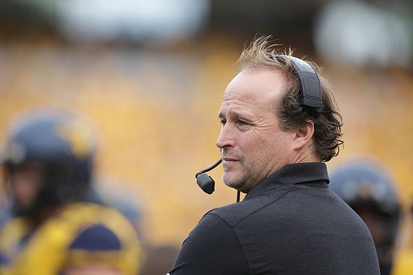 West Virginia coach Dana Holgorsen watches his team play Maryland during a game last season in Morgantown, W.Va. Holgorsen and the Mountaineers will open the season at home Saturday against the Missouri Tigers.