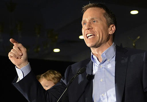 In this Aug. 2, 2016, file photo, Missouri Republican gubernatorial candidate Eric Greitens speaks to supporters in Chesterfield, Mo. On election day a decade ago, Navy SEAL Lt. Eric Greitens was coordinating combat operations in Iraq. Greitens has touted his military service in his campaign during his run for governor against Democratic Attorney General Chris Koster.