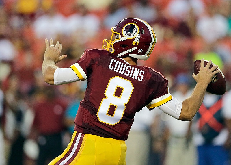 In this Aug. 26, 2016, file photo, Washington Redskins quarterback Kirk Cousins (8) throws the ball during the first half of an NFL preseason football game against the Buffalo Bills, in Landover, Md. Cousins earned himself a one-year contract worth $19.95 million on the franchise tag after throwing for 4,166 yards and 29 touchdowns. 